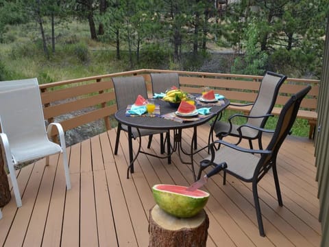 Bear House - Table on deck, seating for 5.