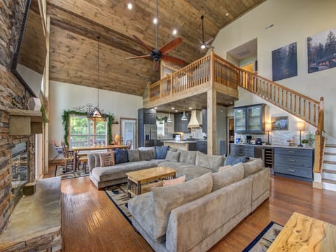 Open concept main level with soring ceiling.