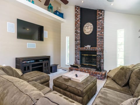 Living room with built-in fireplace. Unit 13 Lot 166, Pine Mountain Lake Vacation Rental, Ridgecrest Rendezvous.