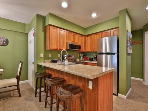 Open kitchen with new appliances.