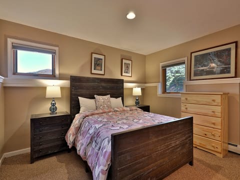 Primary bedroom with queen bed and ensuite bathroom