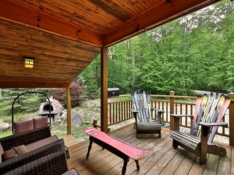 Unique outdoor furniture and views of surrounding forest.