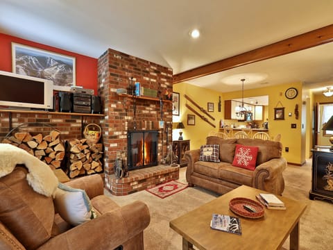 Cozy living room with wood burning fireplace