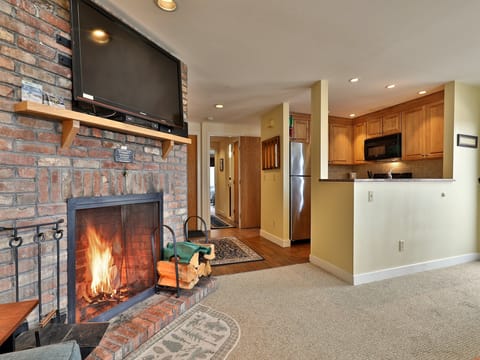 View from the living area to the fully equipped kitchen.