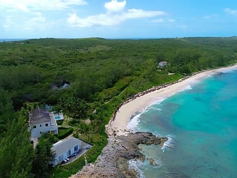 Alfred House and its pool overlooking Casuarina Bay Beach.   The beach is almost always deserted.