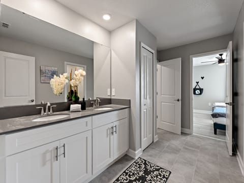 Attached Jack and Jill bathroom with a walk in shower, double sink