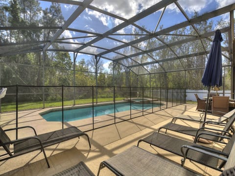 Spacious pool area with loungers
