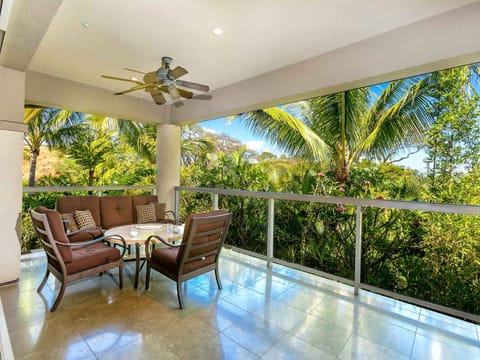 Relax on Upper Lanai Furniture Enjoying Lush Tropical Area