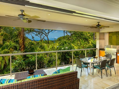 Grill area includes plenty of counter space and fridge