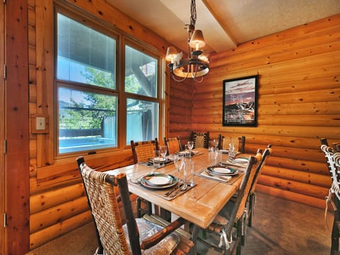 Solid wood dining table in the first dining room, seating for 6 in high back log wood chairs