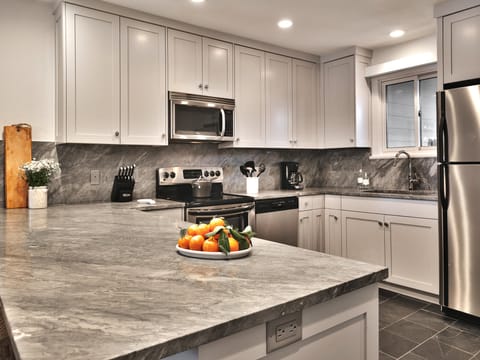 Beautifully upgraded kitchen features stainless steel appliances
