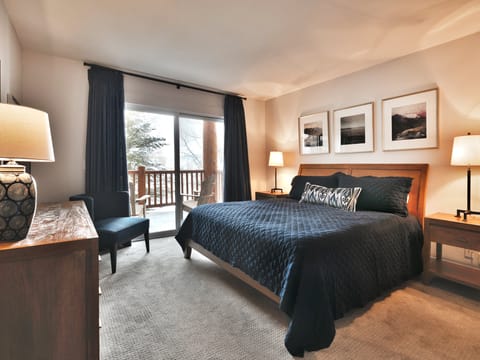 Main Bedroom features a luxurious king-sized bed