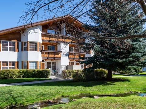 Homes exterior, showcasing the Swiss inspired craftsmanship, two balcony with mountain views and a patio with a gas BBQ.