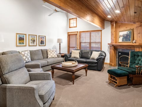 Family room with a cozy fire place and a extra large flat screen TV.  This area would be ideal for a family movie night.  

Coming to watch the big game, this space is a sports lovers paradise.