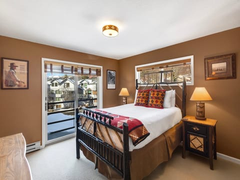 The main bedroom is furnished with a cozy queen bed, flat screen TV, Juliette balcony and plenty of space for your belongings.