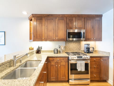 The kitchen is complete with granite counter tops, breakfast bar, and updated appliances!