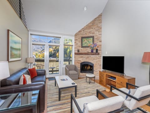 Beautiful mountain, box canyon views from the comfortable living room with fireplace.