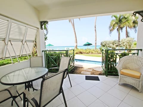 Our private patio with a dining and lounge option overlooking the pool and sea