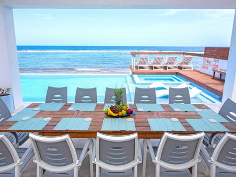 Outdoor table with oceanfront view.