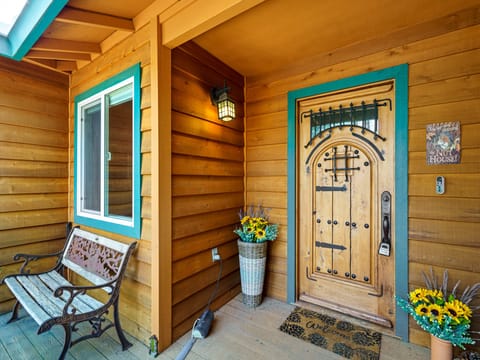 Front door entry. Deck and lounge chair. Pine Mountain Lake Vacation Rental "The Nut House" - Unit 7 Lot 180.