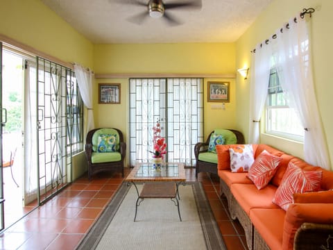 The living area opens right onto the patio and pool deck