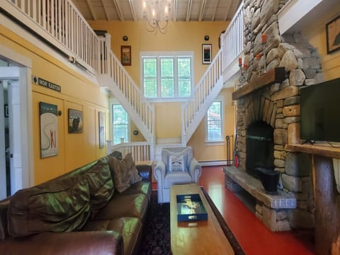 The main level living room with fireplace. It is wood burning and wood is provided.