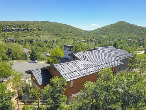 Another ariel view in front of the house showcasing the mountain views.