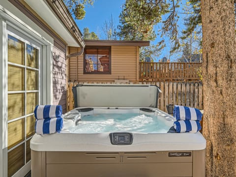 Private hot tub in the back yard with high privacy fence