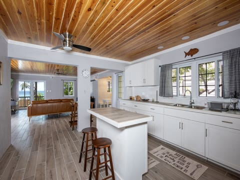 Modern kitchen and great room with ocean views.