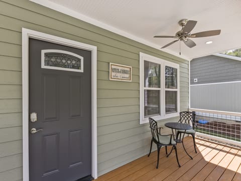 Welcoming front porch invites you to sit and relax.