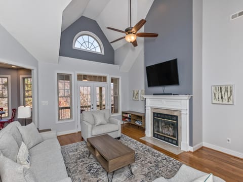 Living room with gas log fireplace and a flat screen TV