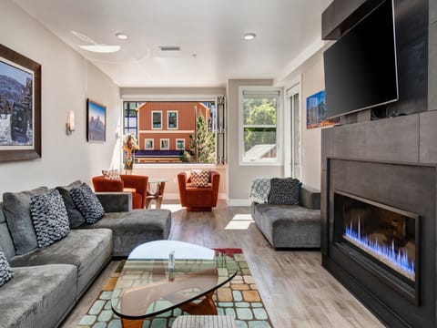 Stunning living room large screen TV beautiful gas fireplace gracious open floor plan