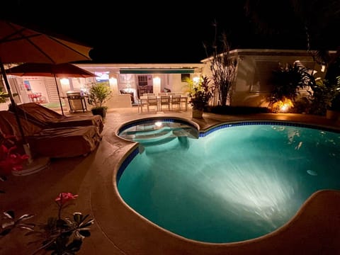 View of the house from the pool deck at night