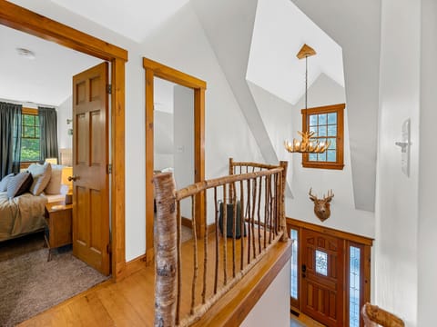 Hallway showing antler chandelier.