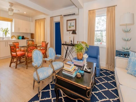 Living area with 18th-century Louis pieces and Scholz Ralf chairs.