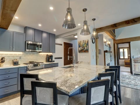 A nicely updated kitchen with plenty of bar stool seating around the island.