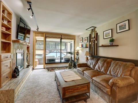 A cozy living room featuring a queen sleeper sofa.