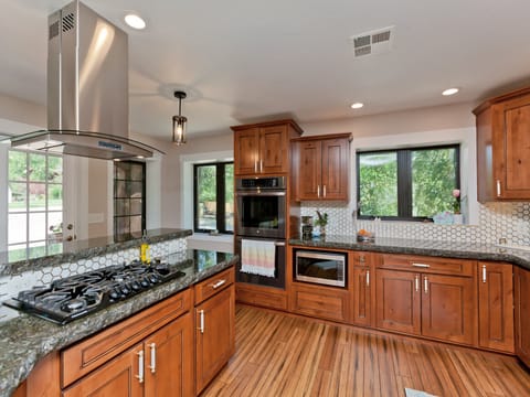 Updated and well-equipped kitchen with dual ovens for preparing large meals