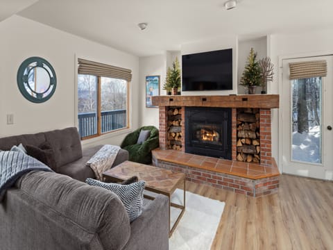 Relax by the fireplace after a fun day on the mountain