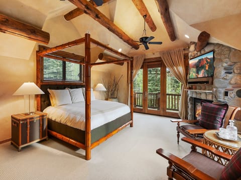 The master suite encompasses the top level of this charming home and features spa like bathroom, office and private deck.