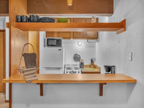 Pass through Breakfast Bar to Dining Area. The Kitchen has all the essentials for cooking a great home cooked meal.