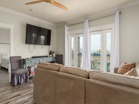 Coastal Château Living Room with Sectional and Smart TV
