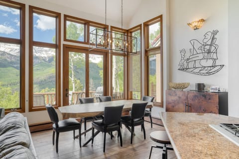 Beautiful dining area with floor-to-ceiling windows and views.