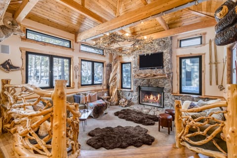 Cosy living area with a fireplace and amazing woodsman design.