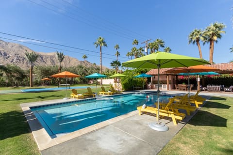 Entertainer's paradise with a pool, pickleball court, bocce ball area, and tons of outdoor lounge space.