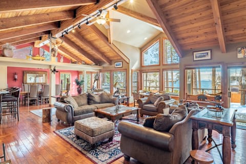 Frosted Shore features a stunning interior with vaulted ceilings and huge windows.