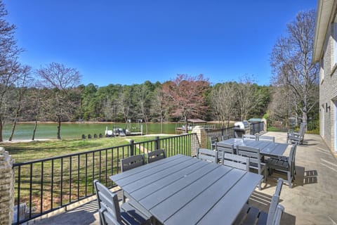 Main Level deck with grill (propane provided) and two tables for seating 16!