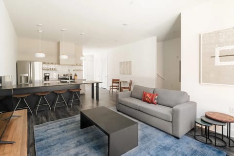 Living, dining & kitchen spaces blend seamlessly in this open-concept area.