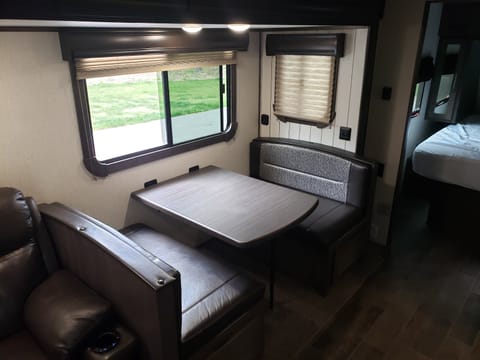 Recliners, outdoor kitchen, and fully furnished Towable trailer in Dellona