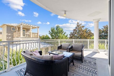 Cozy outdoor seating with treetop views.